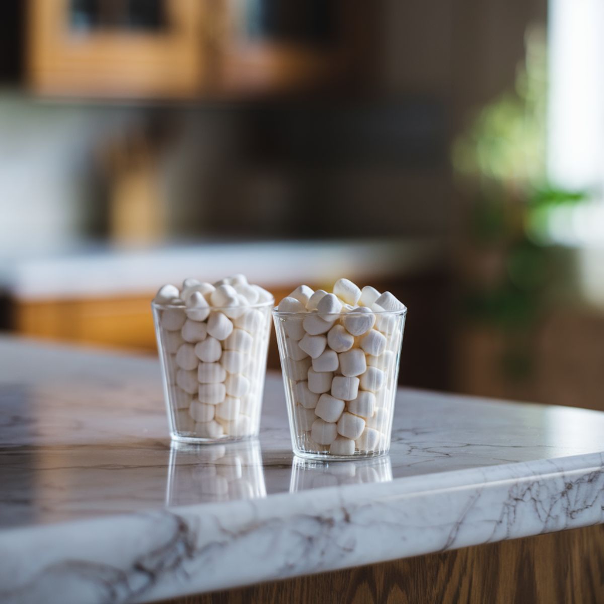 Two cups filled with marshmallows for Sweet Potato Casserole Recipe .
