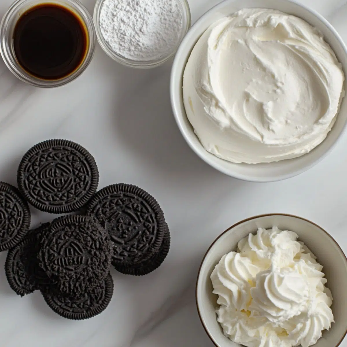 Ingredients laid out for Oreo cheesecake cups including cookies, cream cheese, and sugar

