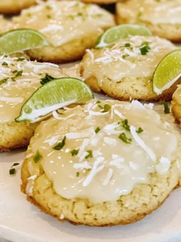 Homemade coconut lime cookies with lime zest on a plate