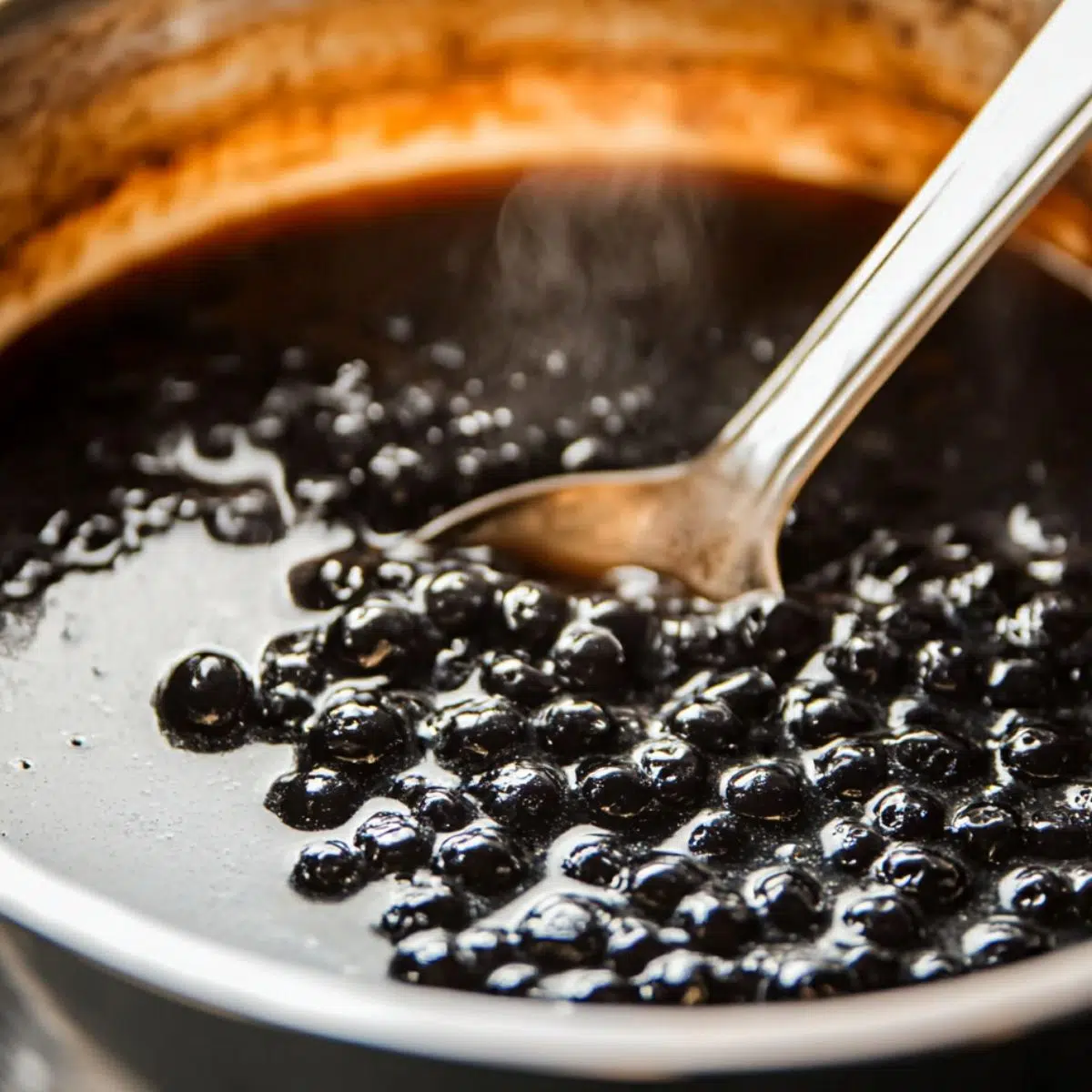 Pot of tapioca pearls cooking on the stovetop for homemade boba