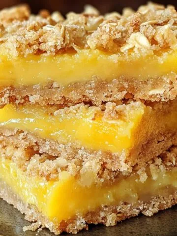 Homemade oatmeal mango crumble bars , shot from above on a white counter