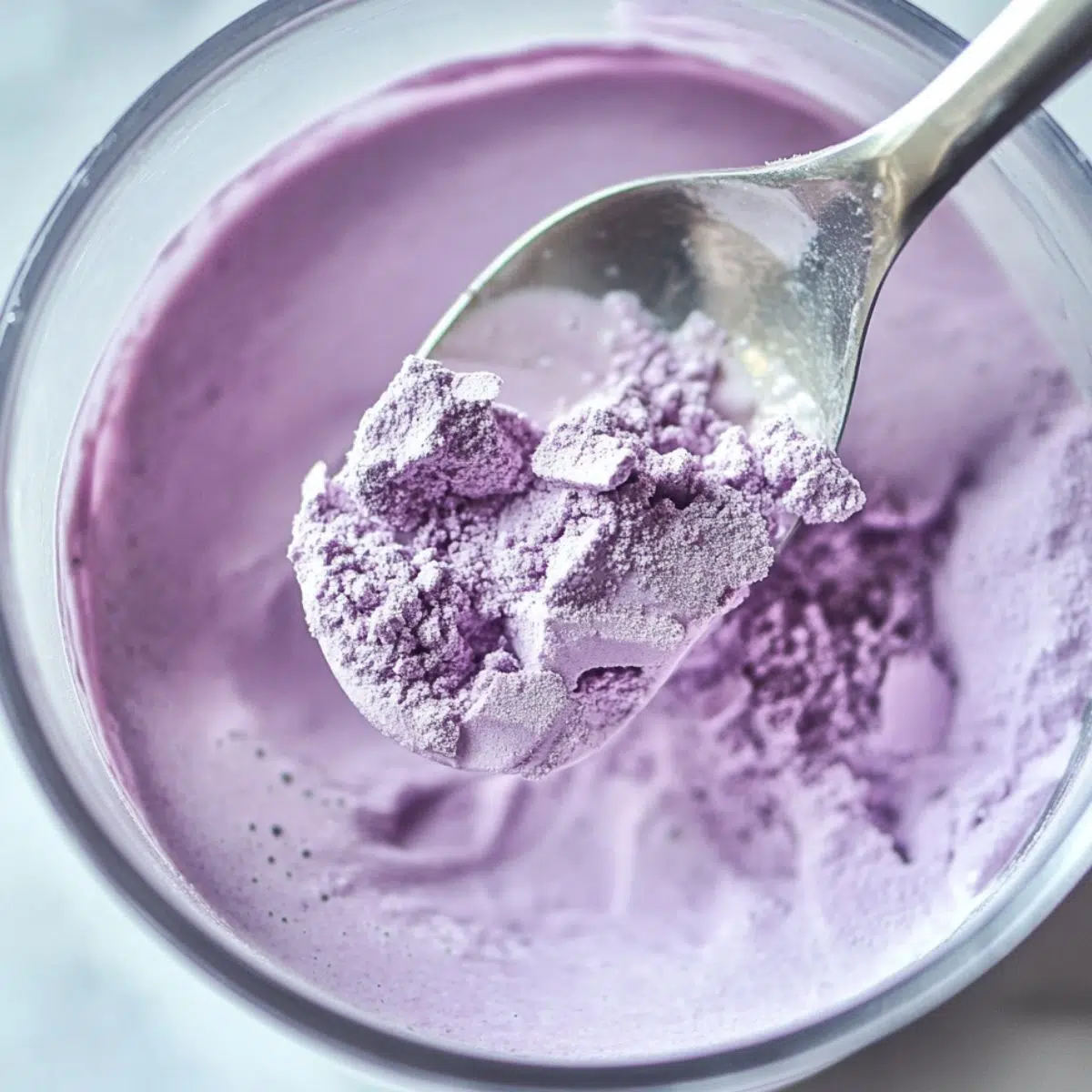 Stirring taro powder into milk to make taro milk tea
