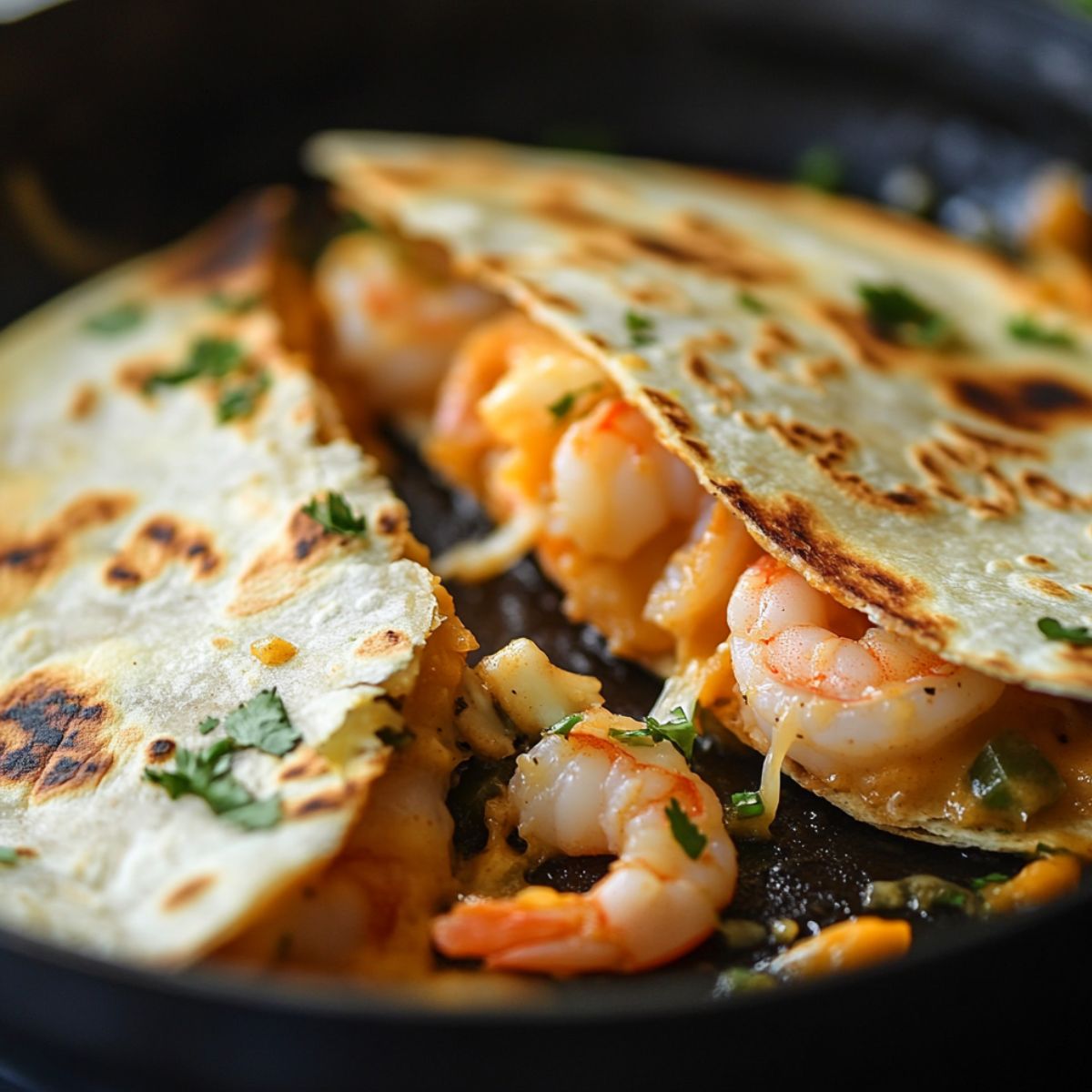 Quesadilla cooking in a skillet, edges crisping and cheese melting.