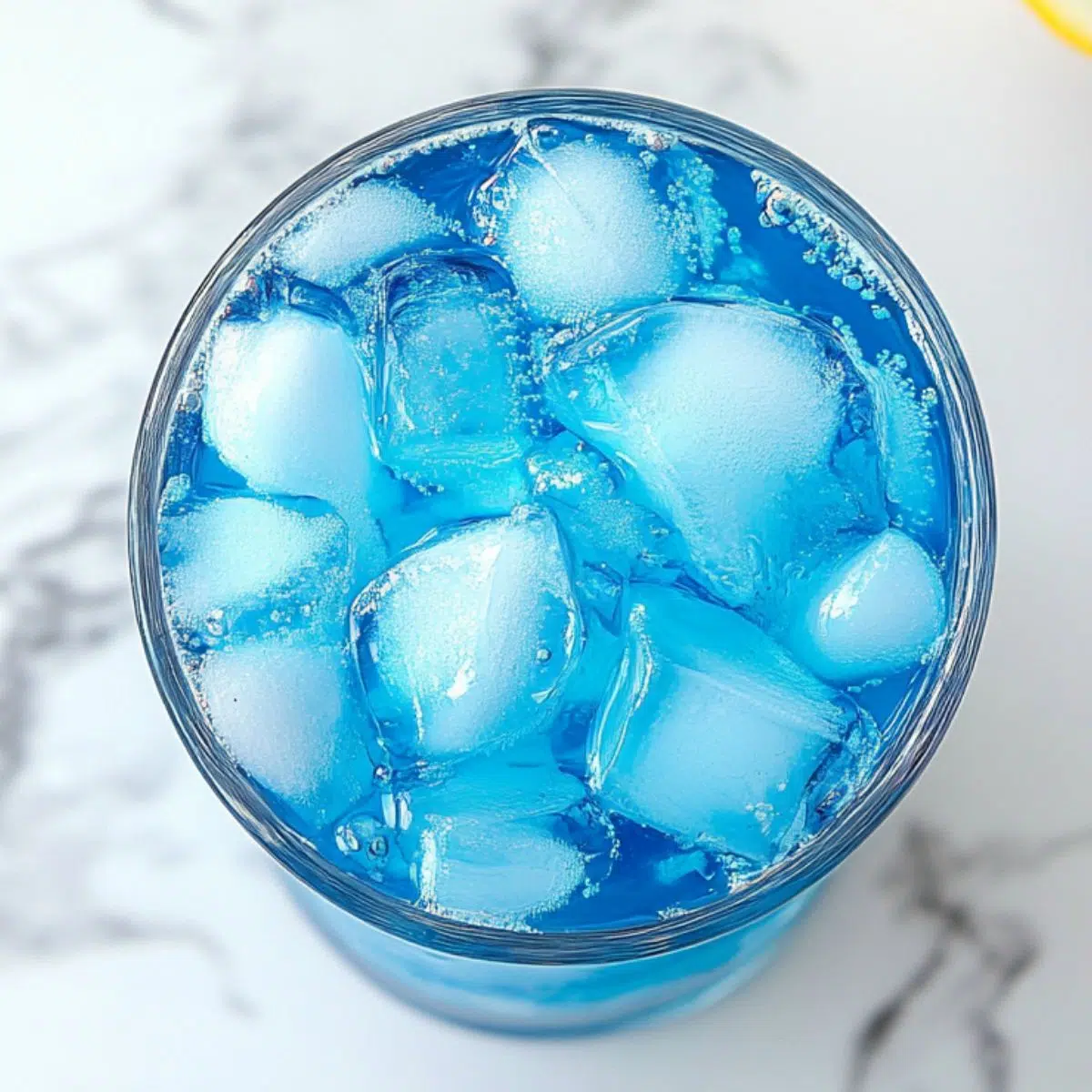 Pouring Sonic Ocean Water into a glass with ice