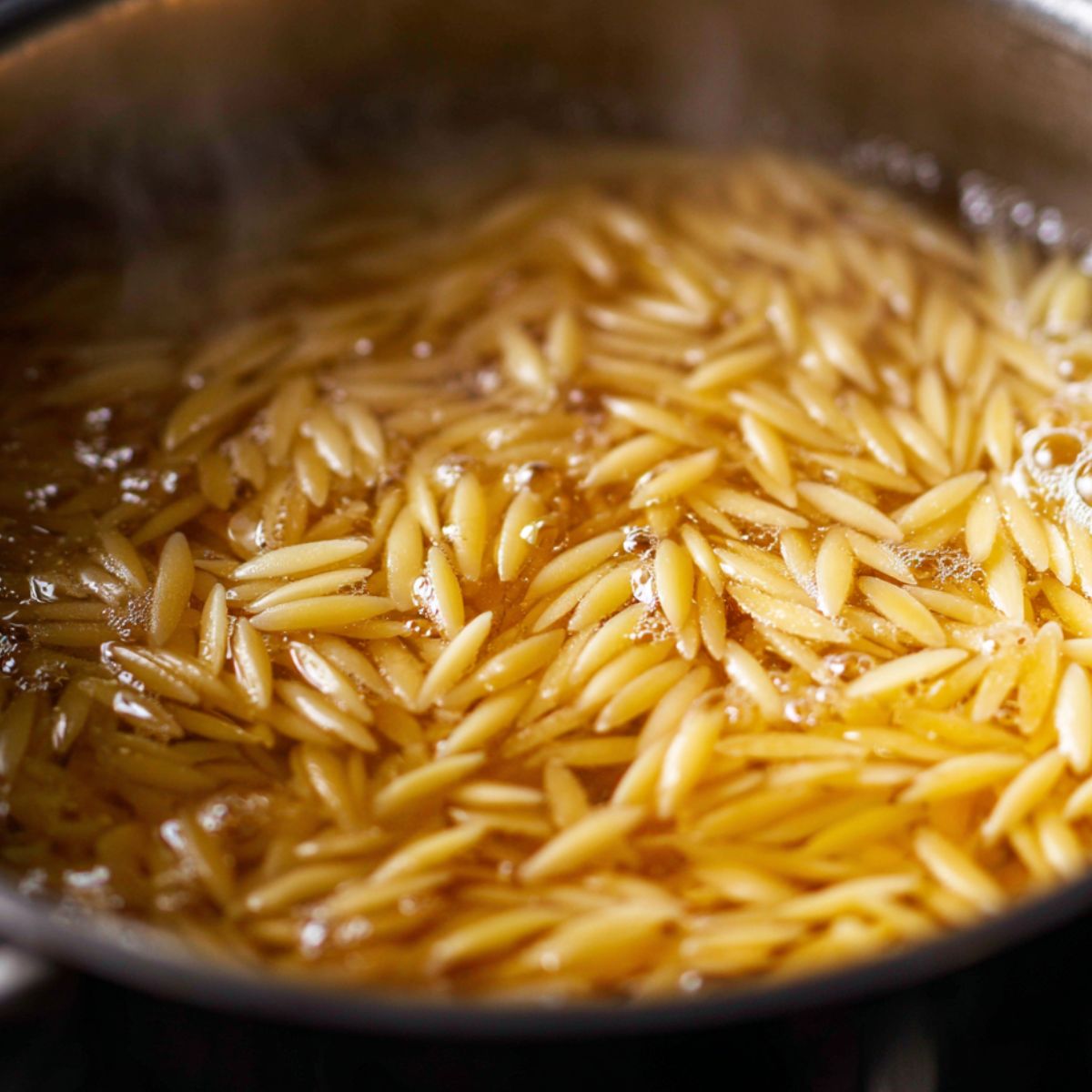  Pot of orzo pasta boiling on the stove