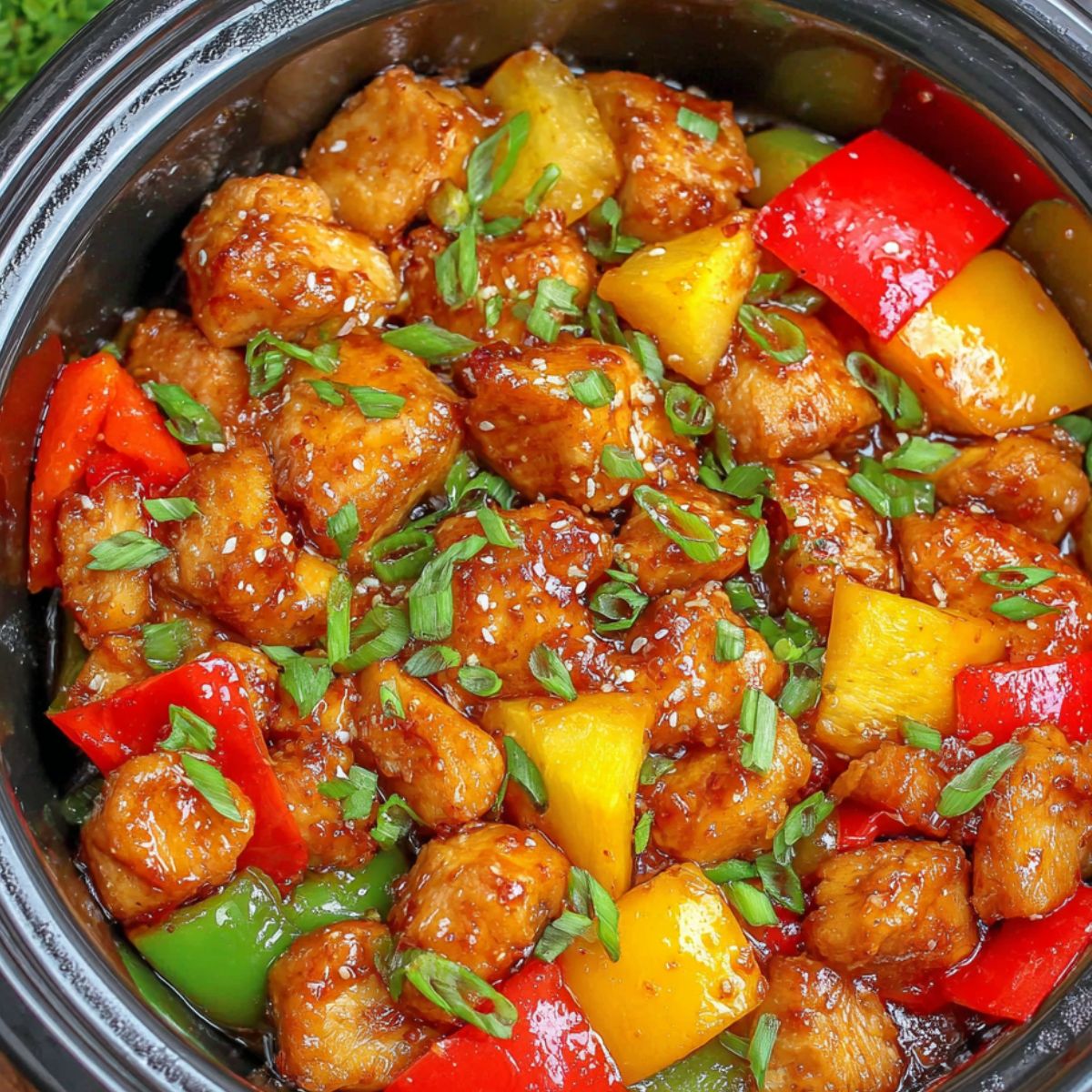 Sweet Hawaiian Chicken simmering in the crockpot.