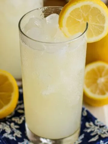 Creamy lemonade in a tall glasses on a white kitchen counter