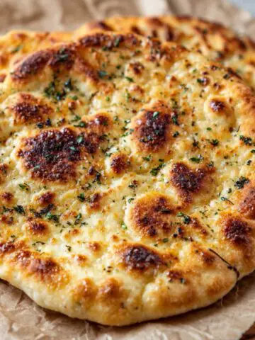 Homemade viral cottage cheese flatbread on parchment paper