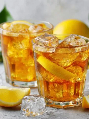 Homemade lemon iced tea on a white kitchen counter