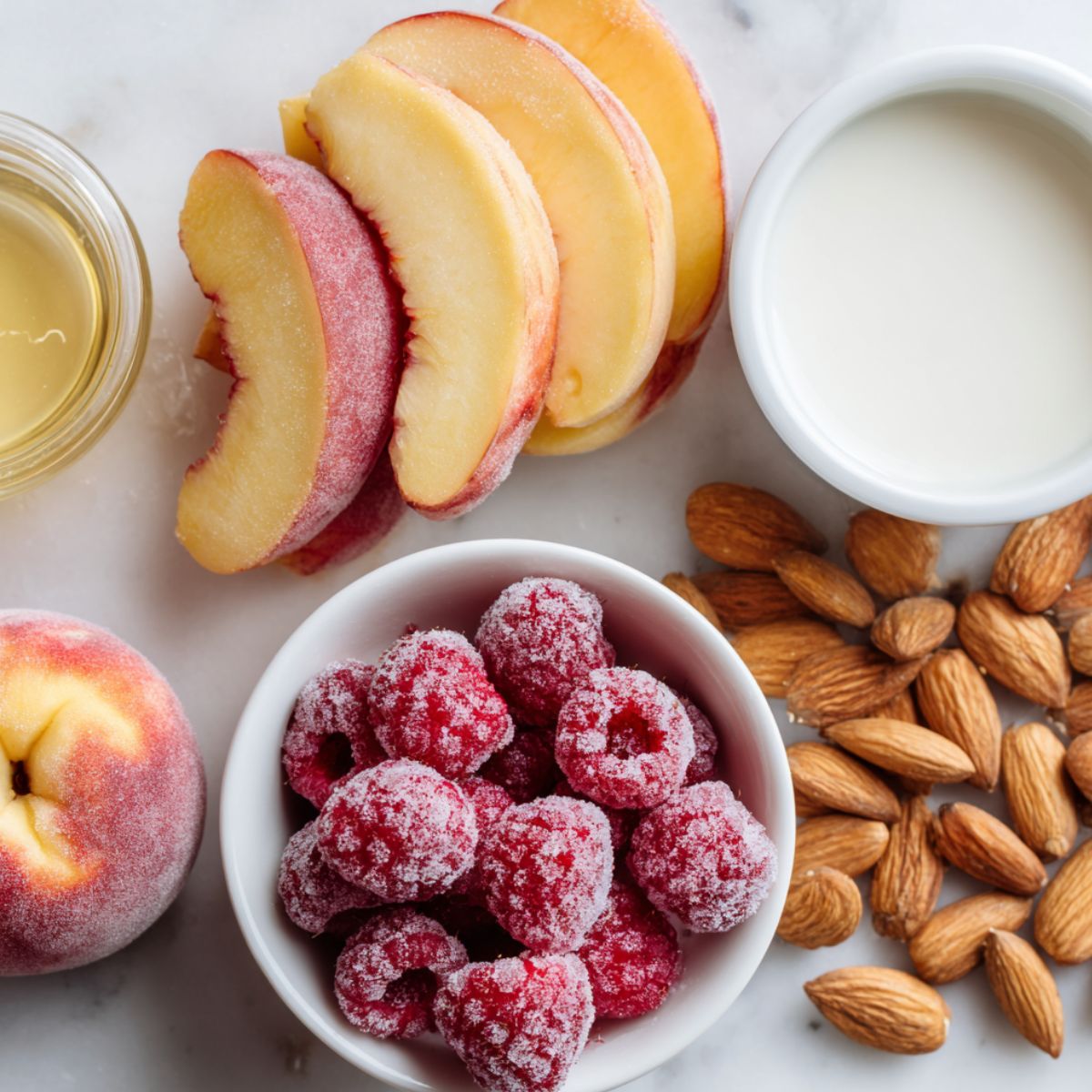 Flat lay of ingredients for raspberry peach smoothie