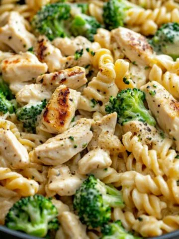A Skillet of creamy rotisserie chicken broccoli pasta
