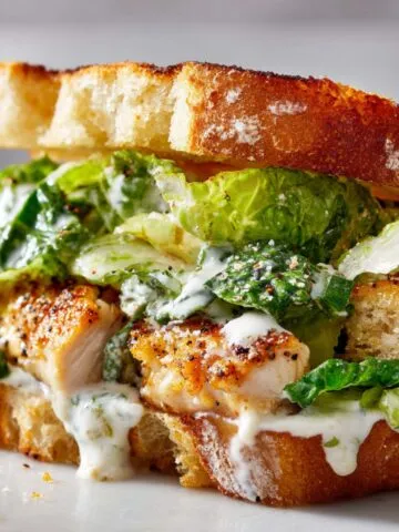 Homemade Chicken Caesar Sandwich with romaine and parmesan on sourdough
