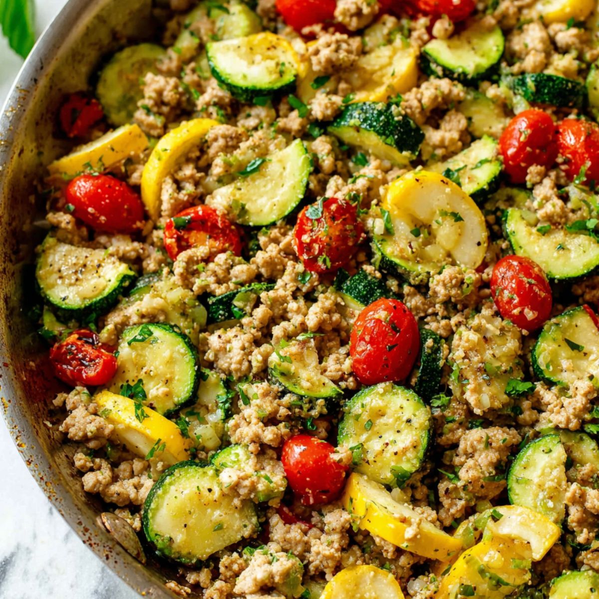 Top-down view of a homemade ground turkey and zucchini skillet meal