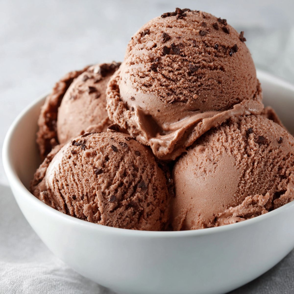 Homemade low carb cottage cheese ice cream served in a bowl on a kitchen counter