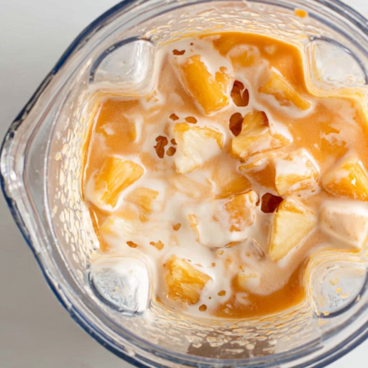 Ingredients layered in a blender ready to mix