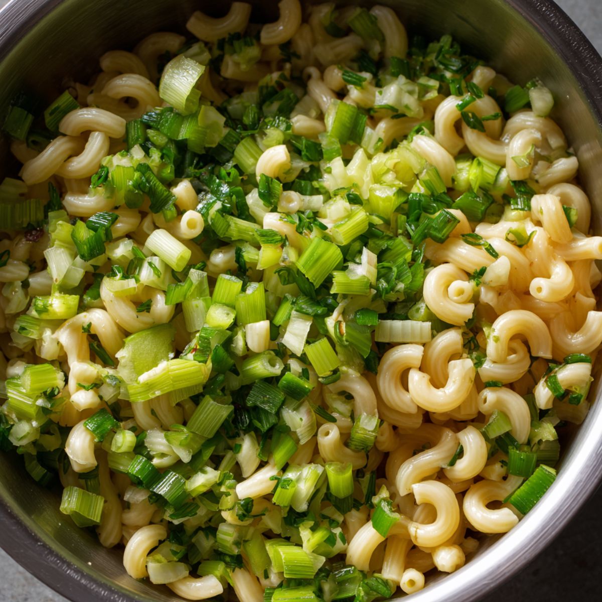 Add chopped vegetables and relish into the pasta base.