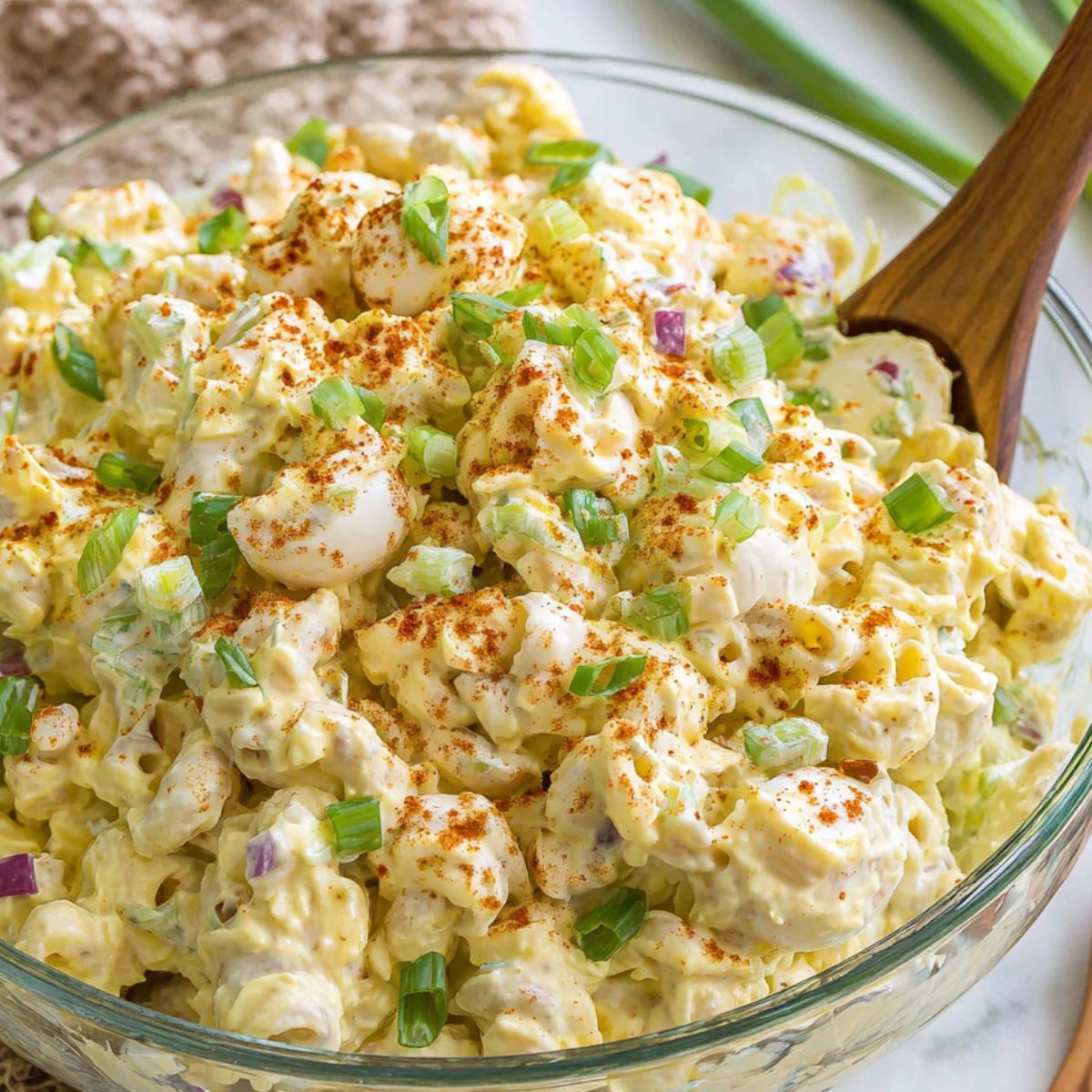 Finished deviled egg pasta salad with paprika garnish