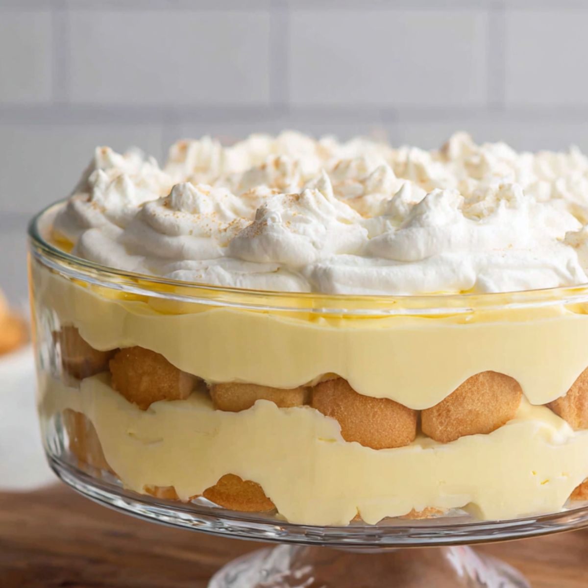 Homemade banana pudding layered in a glass dish, ready to chill in the fridge