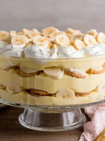 Homemade banana pudding served in a glass bowl on a white kitchen counter