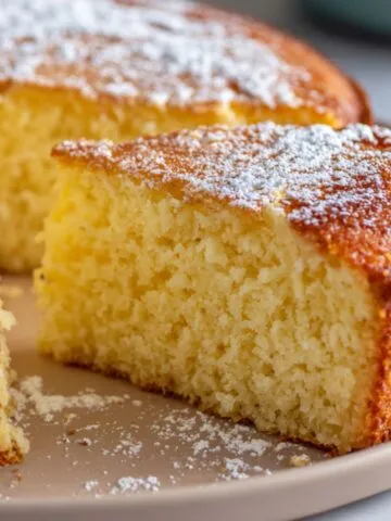 Homemade fluffy Chinese egg cake sliced on a white kitchen counter