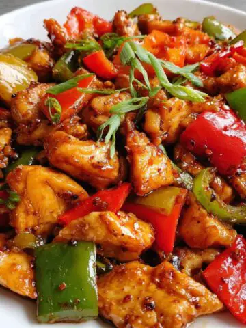 Homemade Chinese black pepper chicken served on a plate with vegetables