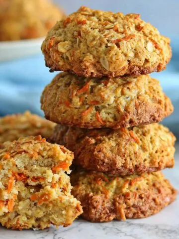 Freshly baked carrot oatmeal cookies cooling on a kitchen counter