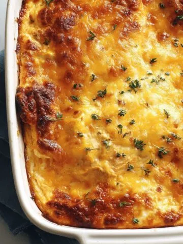 Overhead view of homemade keto buffalo chicken dip served on a white kitchen counter