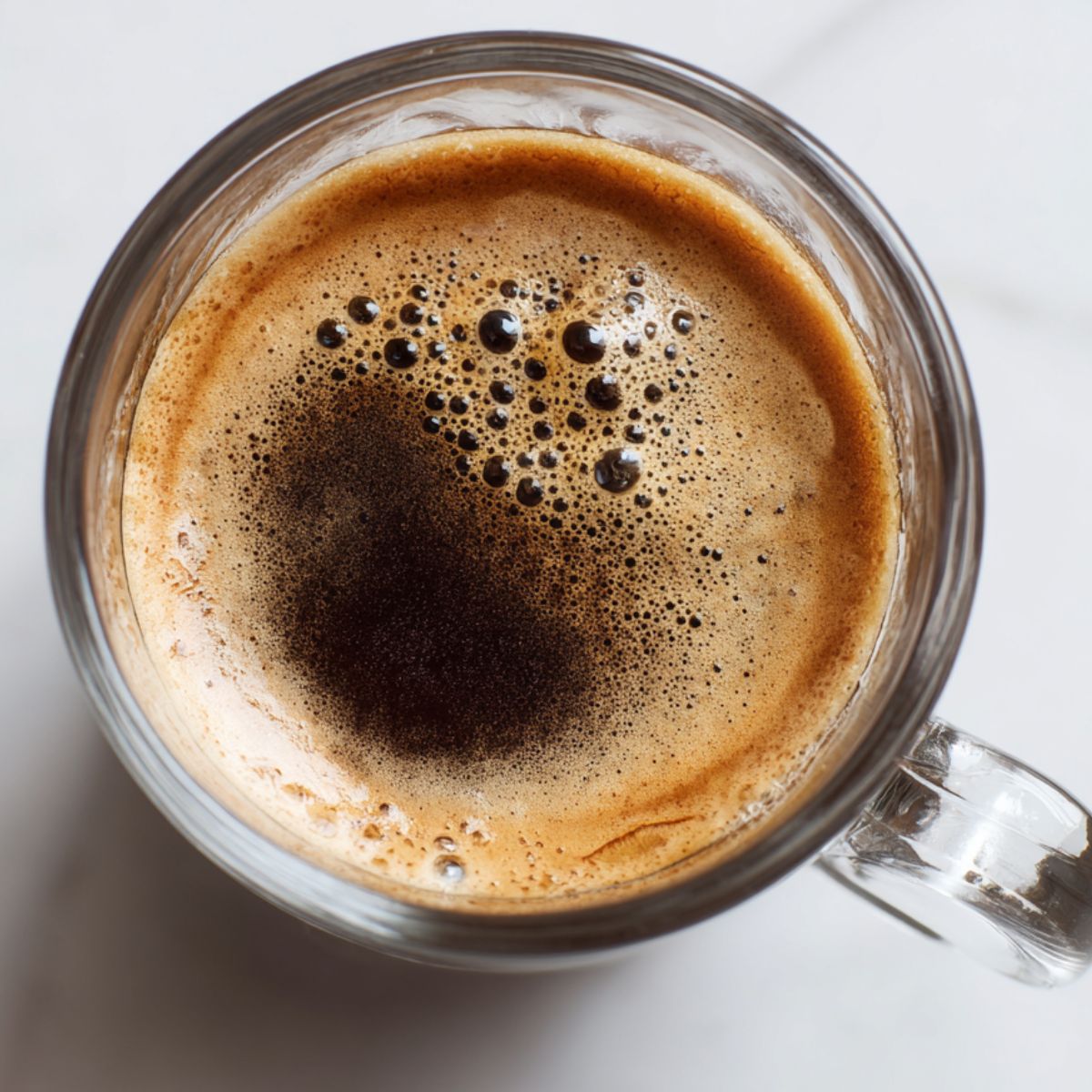 Fresh espresso cooling on a white kitchen counter