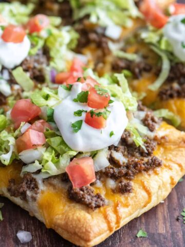 Overhead view of a homemade Crescent Roll Taco cheese and taco toppings