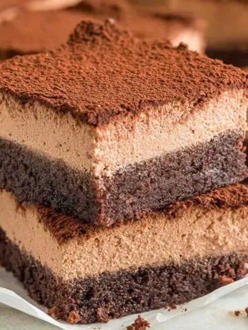 Homemade chocolate mousse brownies on a white kitchen counter seen from above