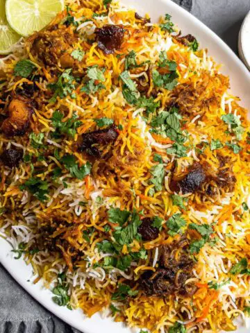 Homemade vegetable dum biryani recipe on a kitchen counter