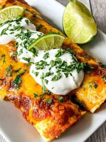 Homemade taquito enchilada casserole fresh out of the oven on a white kitchen counter