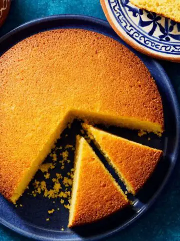 Homemade semolina cake freshly baked with golden crust on a kitchen counter