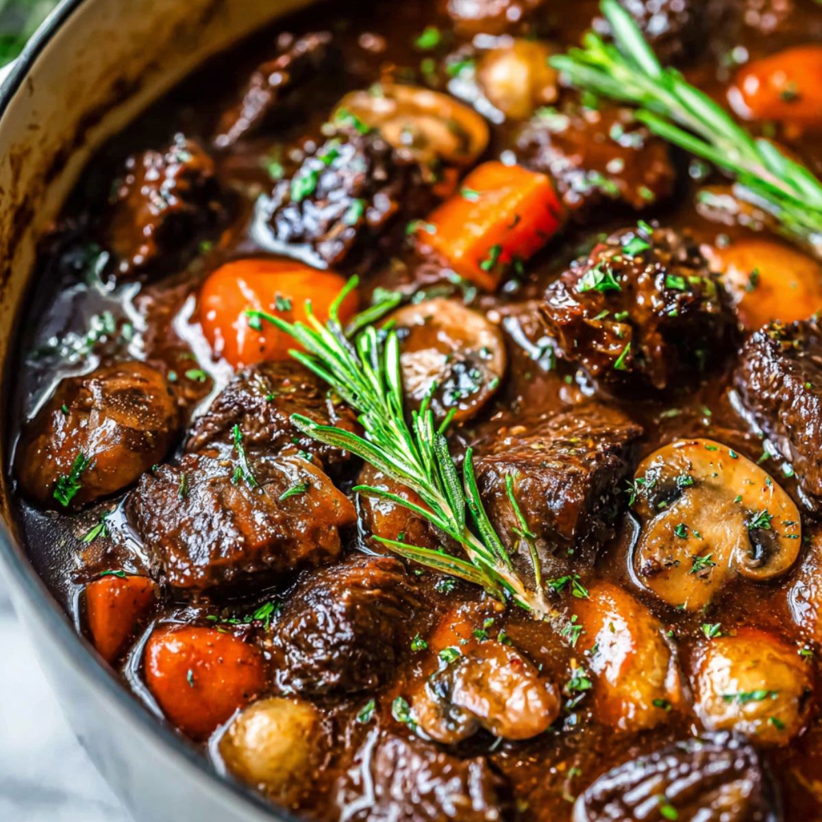 Homemade Bourguignon Beef Slow Cooker , served in a bowl on a white kitchen counter