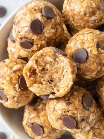 A small batch of homemade cottage cheese protein balls on a white kitchen counter, top-down view