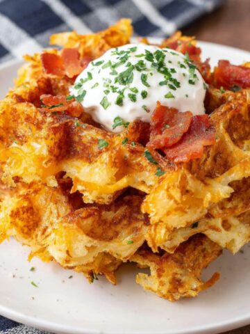 Crispy homemade hash brown waffles on a white kitchen counter,