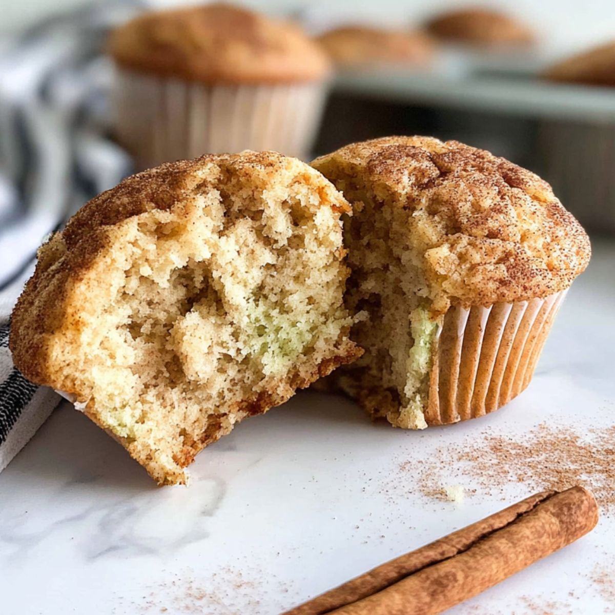 Homemade cinnamon protein muffins on a white kitchen counter