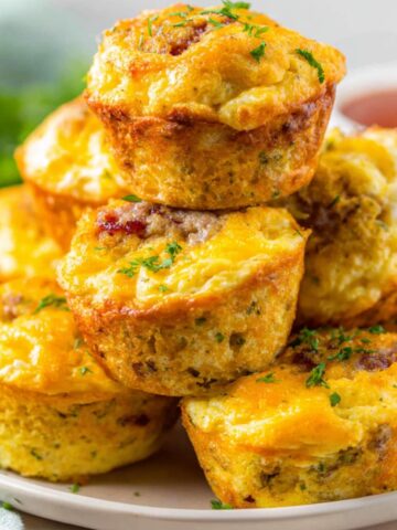 Homemade McGriddle Bites on a white kitchen counter, top-down shot with maple syrup drips.
