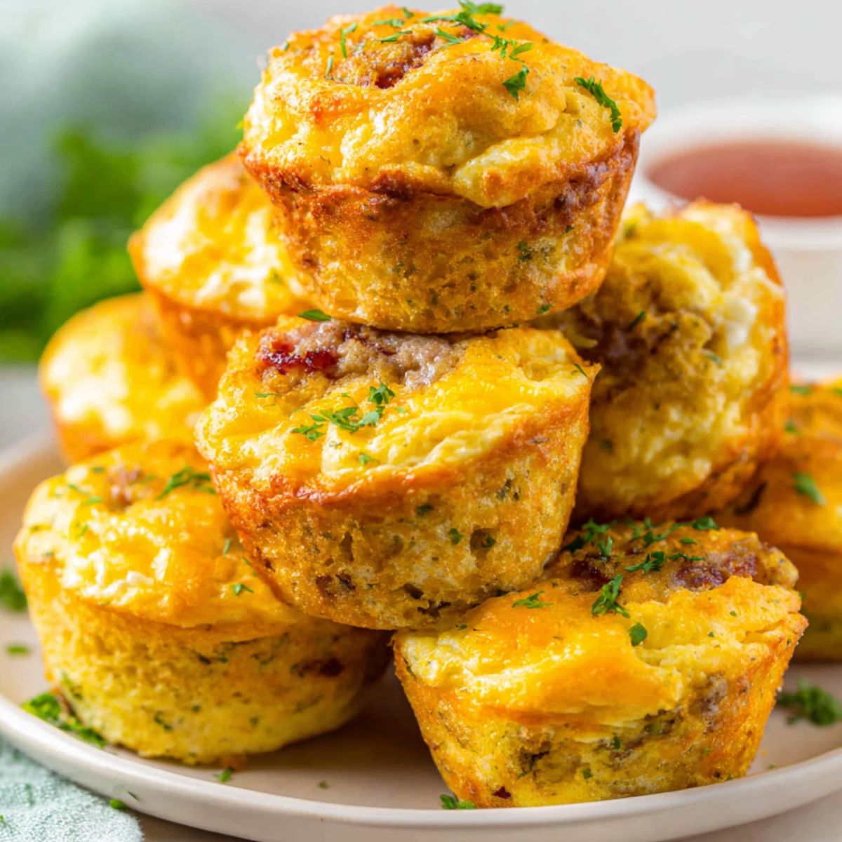 Homemade McGriddle Bites on a white kitchen counter, top-down shot with maple syrup drips.
